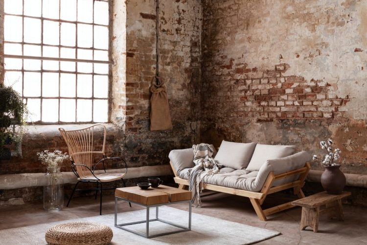 armchair-and-beige-sofa-in-industrial-living-room-interior-with.jpg